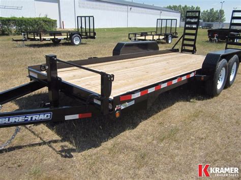 sure trac skid steer trailer|sure trac website.